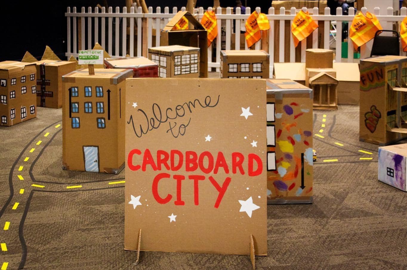 A cardboard sign that says, "welcome to Cardboard City"